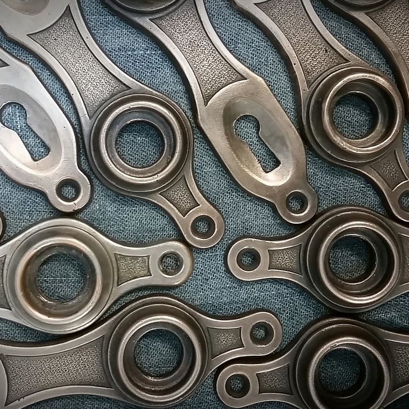 Multiple metal cast door faceplates.
